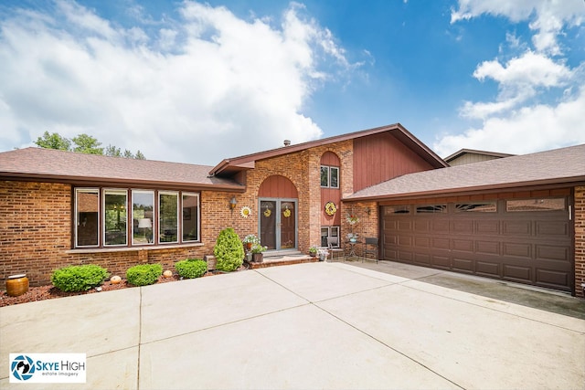14463 S Canvasback Ct, Homer Glen, IL 60491 - view of front of house with an attached garage, driveway, brick siding, and roof with shingles