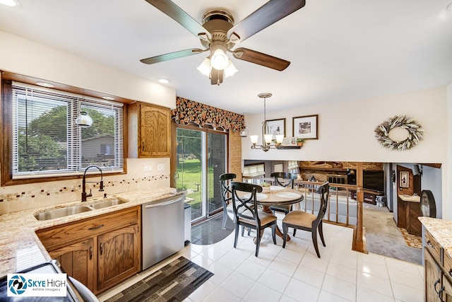 14463 S Canvasback Ct, Homer Glen, IL 60491 - kitchen with stainless steel dishwasher, ceiling fan, decorative backsplash, decorative light fixtures, and light tile patterned flooring