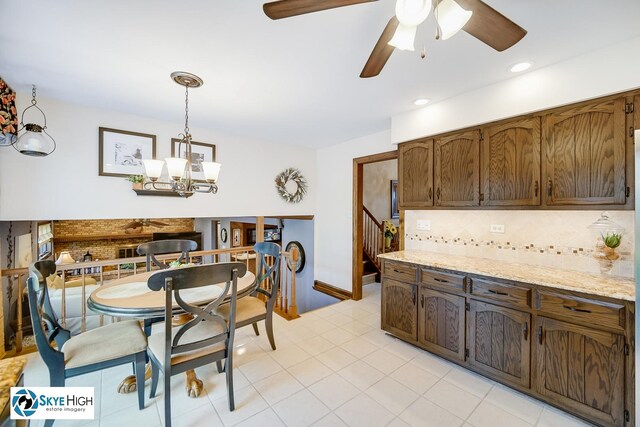 14463 S Canvasback Ct, Homer Glen, IL 60491 - dining space featuring ceiling fan, a chandelier, recessed lighting, and light tile patterned flooring