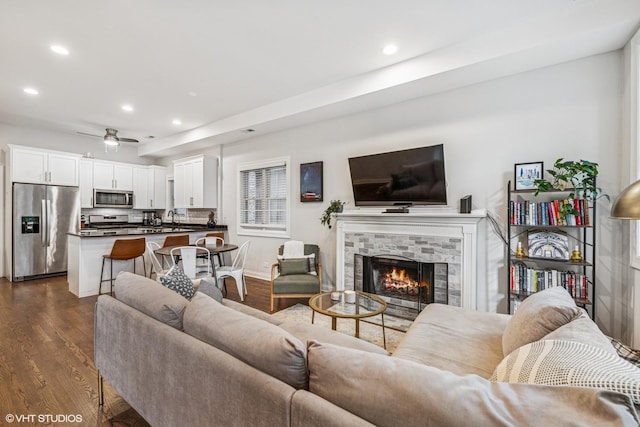 2930 N Damen Ave Unit 2, Chicago, IL 60618 - living room with recessed lighting, dark wood-style flooring, a brick fireplace, and ceiling fan