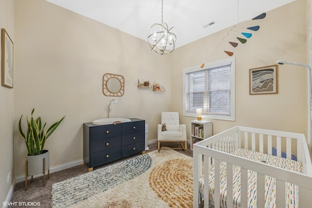 2930 N Damen Ave Unit 2, Chicago, IL 60618 - bedroom featuring carpet, a crib, and a chandelier