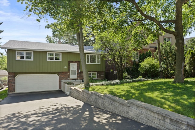 5245 Fairmount Ave, Downers Grove, IL 60515 - raised ranch with brick siding, asphalt driveway, a garage, and a front lawn