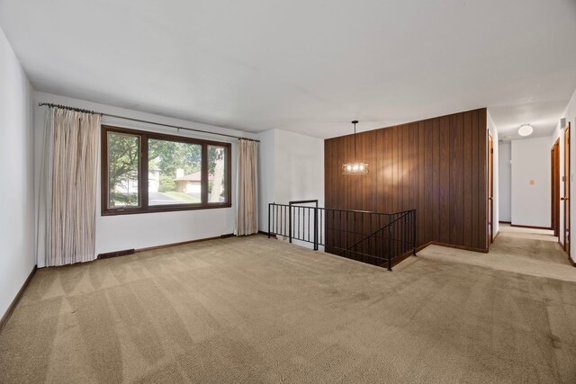 5245 Fairmount Ave, Downers Grove, IL 60515 - carpeted spare room featuring wood walls and baseboards