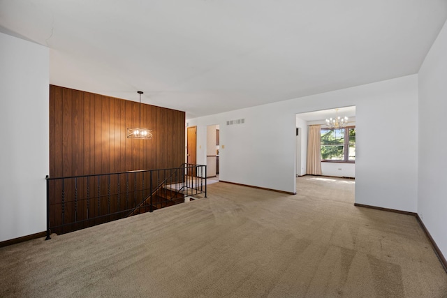 5245 Fairmount Ave, Downers Grove, IL 60515 - empty room with a chandelier, light colored carpet, and wooden walls