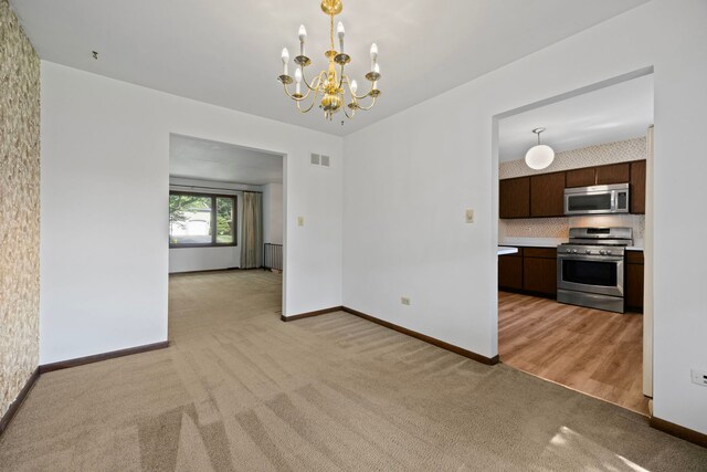 5245 Fairmount Ave, Downers Grove, IL 60515 - unfurnished dining area featuring light carpet and a chandelier