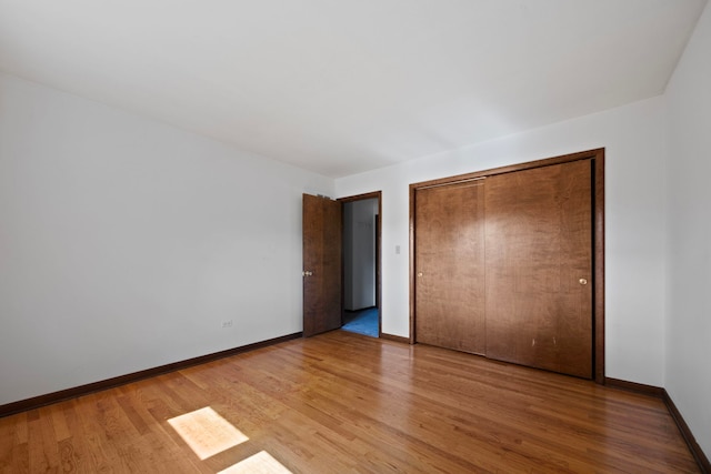 5245 Fairmount Ave, Downers Grove, IL 60515 - unfurnished bedroom featuring light wood-type flooring and a closet