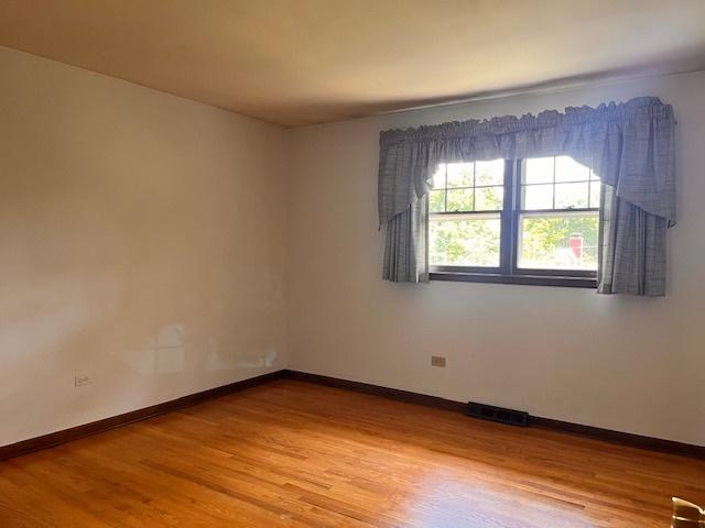 5245 Fairmount Ave, Downers Grove, IL 60515 - spare room with light wood finished floors