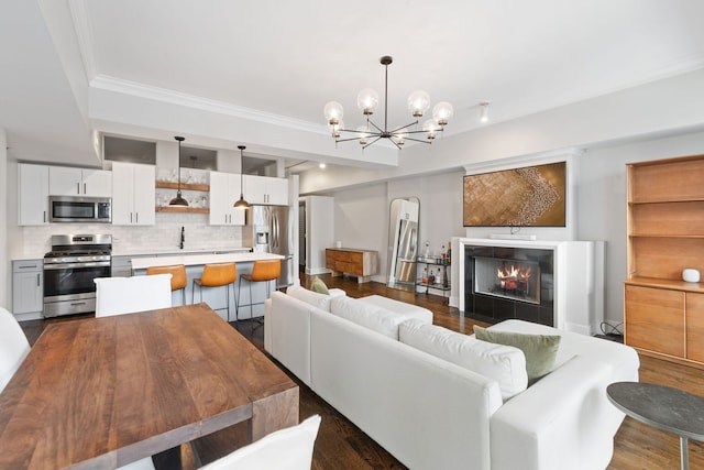 165 N Canal St Unit 1219, Chicago, IL 60606 - living area featuring a chandelier, ornamental molding, arched walkways, dark wood-style floors, and a warm lit fireplace