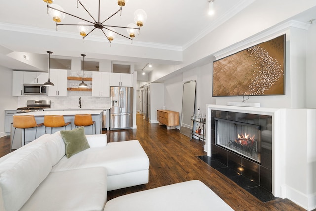 165 N Canal St Unit 1219, Chicago, IL 60606 - living room with dark wood-type flooring, crown molding, a fireplace with flush hearth, and a chandelier