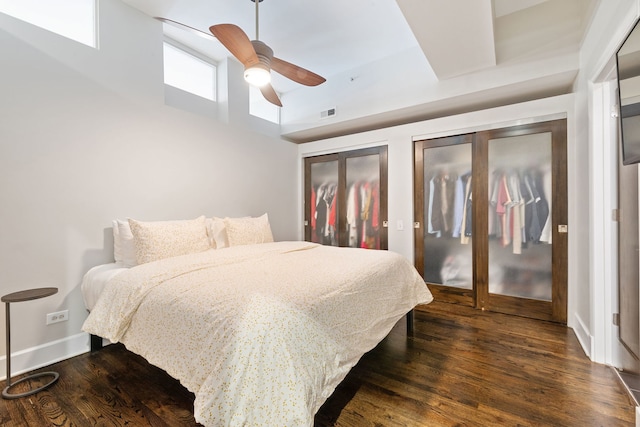 165 N Canal St Unit 1219, Chicago, IL 60606 - bedroom featuring dark wood-style floors, a towering ceiling, multiple closets, and ceiling fan