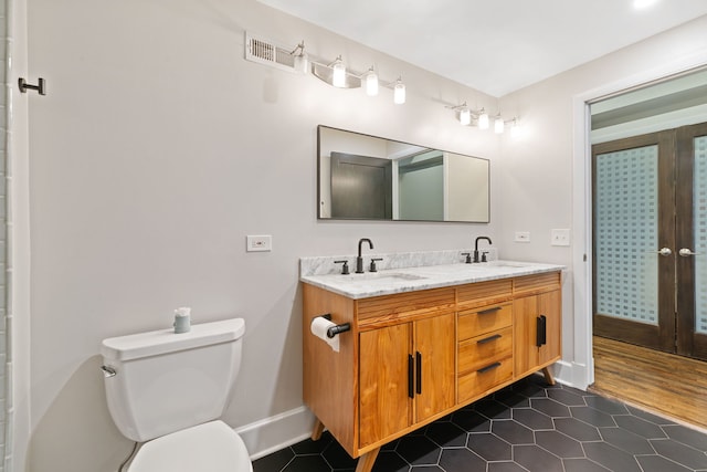 165 N Canal St Unit 1219, Chicago, IL 60606 - bathroom featuring double vanity, tile patterned flooring, and french doors