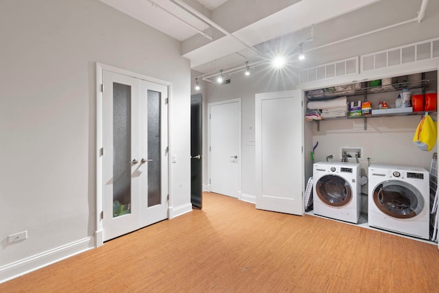 165 N Canal St Unit 1219, Chicago, IL 60606 - washroom with washer and clothes dryer and wood finished floors