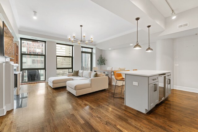 165 N Canal St Unit 1219, Chicago, IL 60606 - kitchen with dark wood-type flooring, a kitchen bar, beverage cooler, light countertops, and crown molding