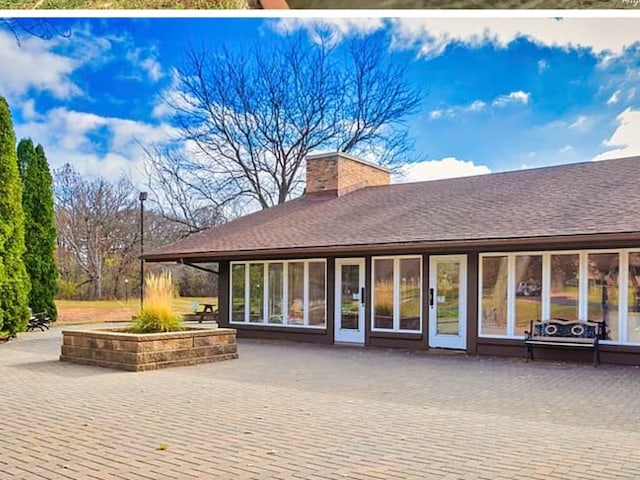45 Nassau Colony Unit 4, Fox Lake, IL 60020 - back of property with a patio, a chimney, and roof with shingles