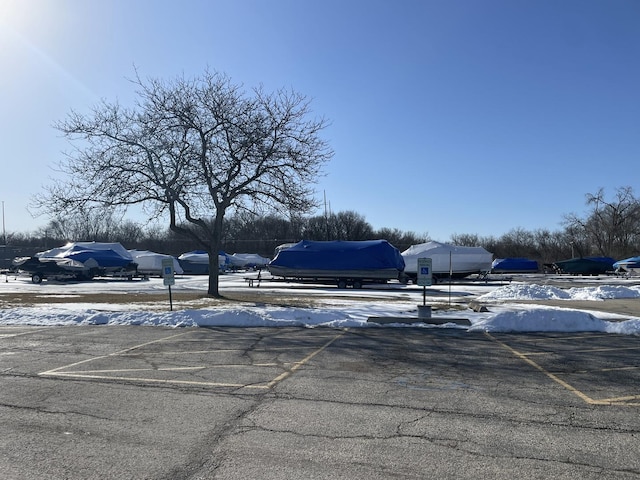 45 Nassau Colony Unit 4, Fox Lake, IL 60020 - snow covered parking area with uncovered parking