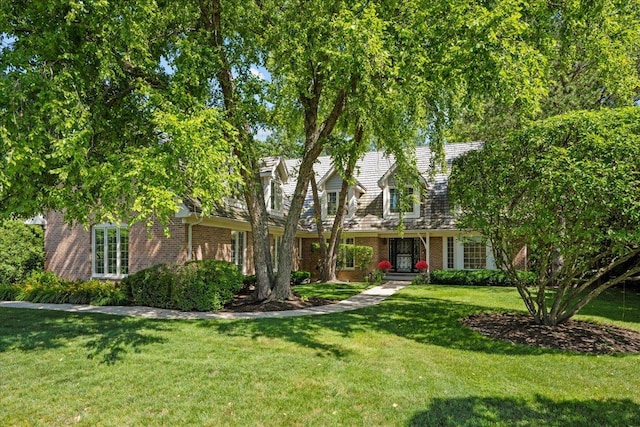1280 Lawrence Ave, Lake Forest, IL 60045 - new england style home with brick siding and a front lawn