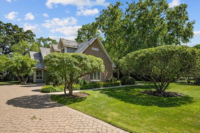 1280 Lawrence Ave, Lake Forest, IL 60045 - view of front of home featuring a front lawn and brick siding