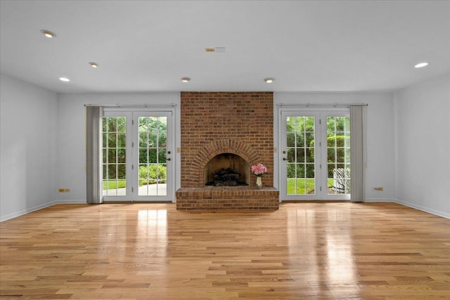 1280 Lawrence Ave, Lake Forest, IL 60045 - unfurnished living room featuring plenty of natural light, light wood finished floors, a fireplace, and recessed lighting