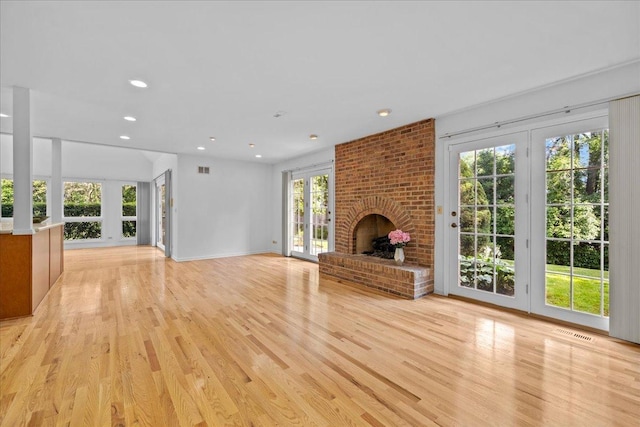 1280 Lawrence Ave, Lake Forest, IL 60045 - unfurnished living room with light wood finished floors, a fireplace, and recessed lighting