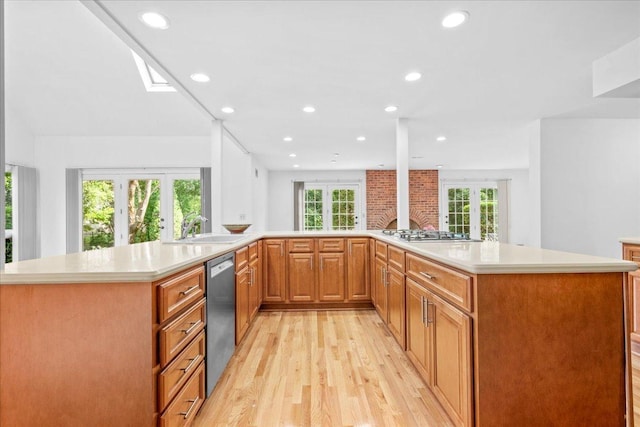 1280 Lawrence Ave, Lake Forest, IL 60045 - kitchen with light wood-style flooring, appliances with stainless steel finishes, recessed lighting, light countertops, and french doors