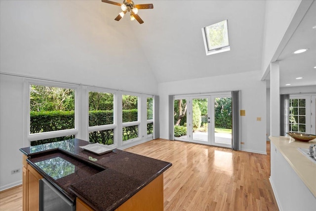 1280 Lawrence Ave, Lake Forest, IL 60045 - sunroom with french doors, wine cooler, a skylight, and vaulted ceiling