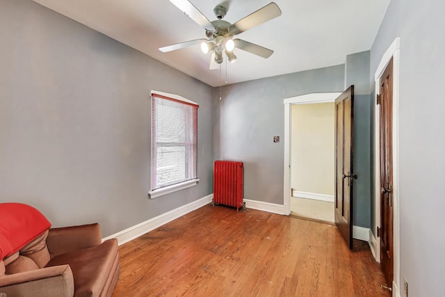 1003 Mapleton Ave, Oak Park, IL 60302 - sitting room featuring radiator heating unit, a ceiling fan, and wood finished floors