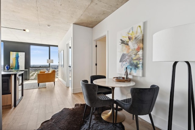 234 W Polk St Unit 3403, Chicago, IL 60607 - dining area with wood finished floors and a wall of windows