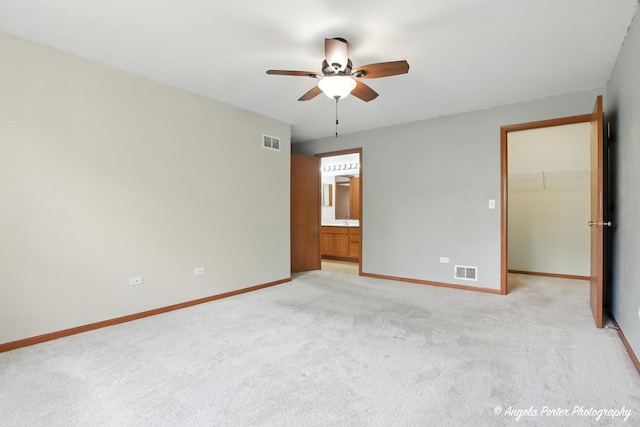 312 Whitaker Trl Unit 312, Mchenry, IL 60050 - unfurnished bedroom with light carpet, a walk in closet, a closet, and ensuite bath