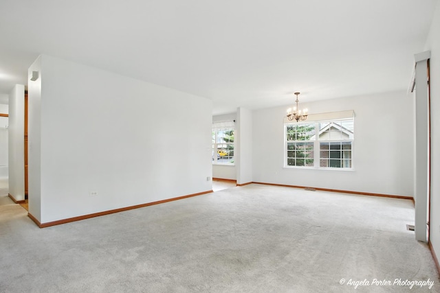 312 Whitaker Trl Unit 312, Mchenry, IL 60050 - unfurnished living room with a chandelier and carpet