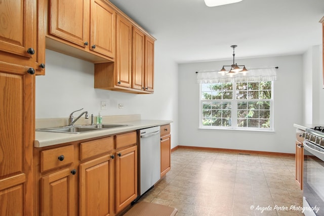 312 Whitaker Trl Unit 312, Mchenry, IL 60050 - kitchen with appliances with stainless steel finishes, light countertops, hanging light fixtures, and brown cabinetry