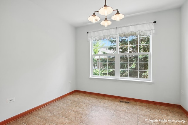 312 Whitaker Trl Unit 312, Mchenry, IL 60050 - unfurnished room with baseboards and a chandelier