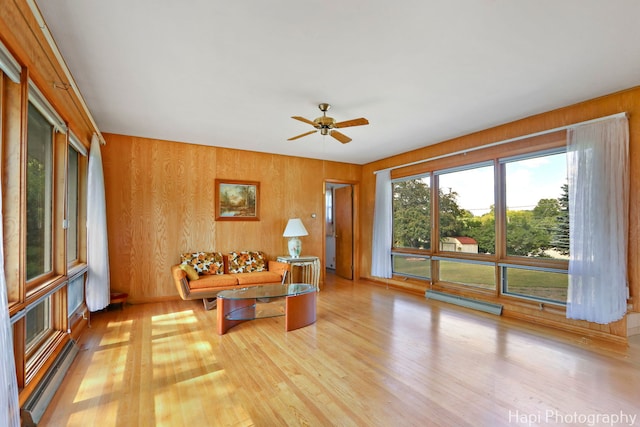 34719 N Nokomis Trl, Mchenry, IL 60051 - living room with a baseboard heating unit, light wood-type flooring, a baseboard radiator, and ceiling fan