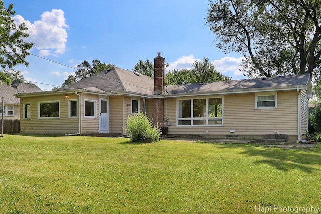 34719 N Nokomis Trl, Mchenry, IL 60051 - back of property featuring a chimney and a lawn