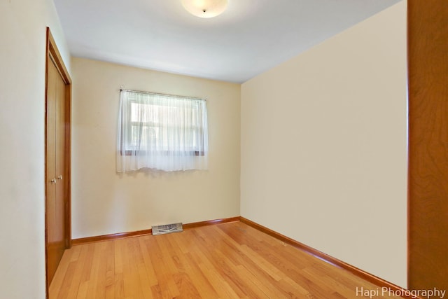 34719 N Nokomis Trl, Mchenry, IL 60051 - unfurnished bedroom featuring a closet and light wood-style floors