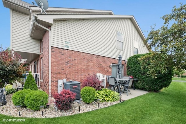 3749 W Glen Dr Unit 1001, Alsip, IL 60803 - back of house with a lawn, a patio area, and brick siding