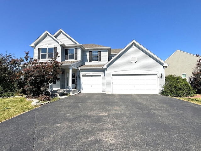 1805 Clarence Rd, Joliet, IL 60431 - view of front of home featuring driveway, an attached garage, and roof with shingles