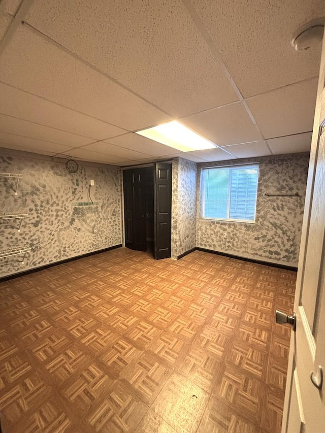 1805 Clarence Rd, Joliet, IL 60431 - below grade area with a paneled ceiling and wallpapered walls