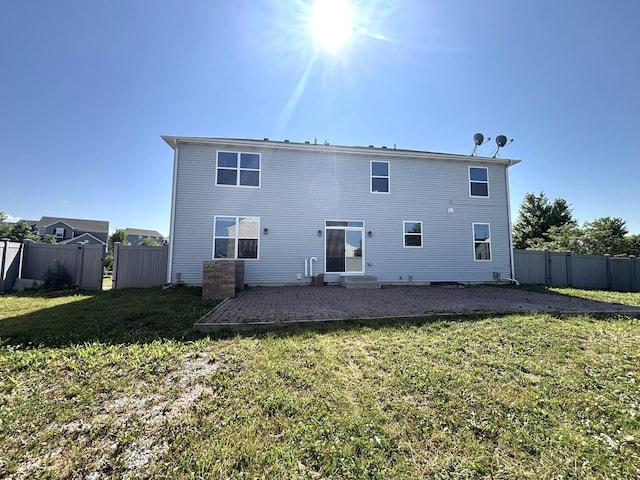 1805 Clarence Rd, Joliet, IL 60431 - back of property with a fenced backyard and a patio area