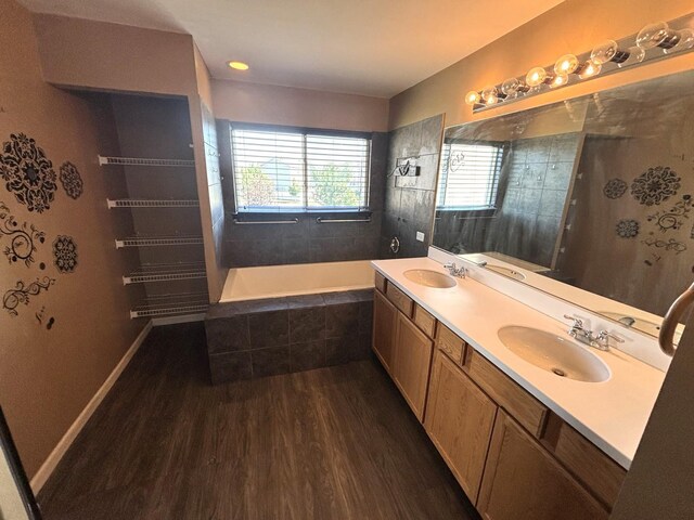 1805 Clarence Rd, Joliet, IL 60431 - bathroom with wood finished floors, double vanity, tiled tub, and tiled shower