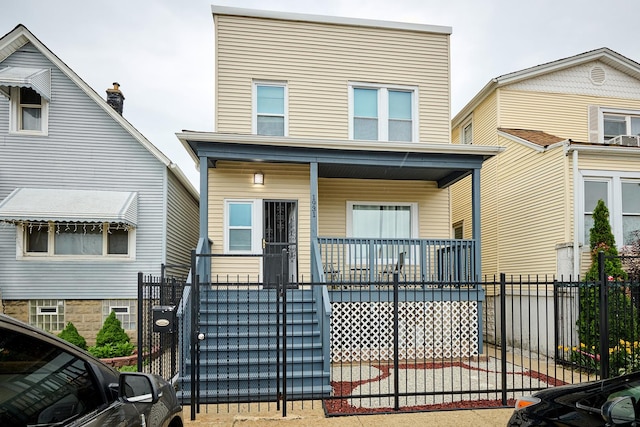 1931 N Leamington Ave, Chicago, IL 60639 - view of front of home with covered porch and a fenced front yard