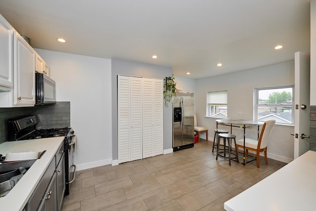 1931 N Leamington Ave, Chicago, IL 60639 - kitchen with stainless steel fridge with ice dispenser, gas range, recessed lighting, tasteful backsplash, and light countertops