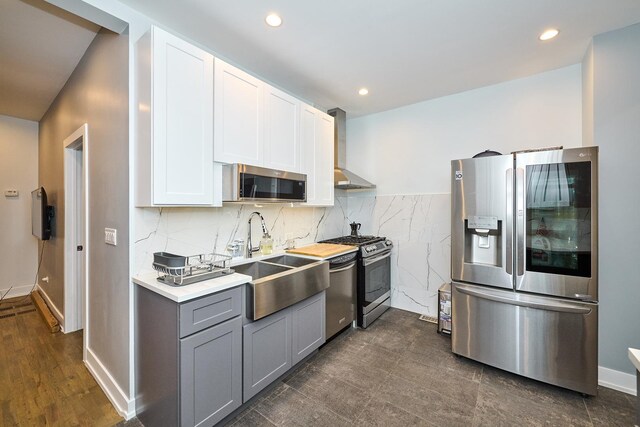 1931 N Leamington Ave, Chicago, IL 60639 - kitchen with stainless steel appliances, wall chimney range hood, gray cabinetry, light countertops, and white cabinetry