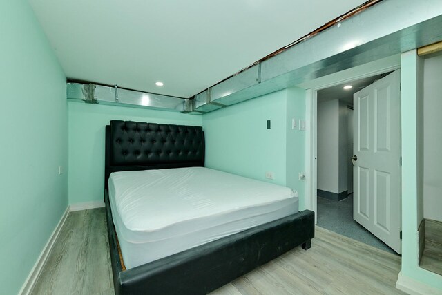 1931 N Leamington Ave, Chicago, IL 60639 - bedroom with light wood finished floors and recessed lighting