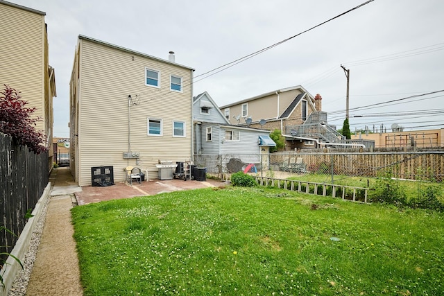 1931 N Leamington Ave, Chicago, IL 60639 - rear view of property featuring a patio and a fenced backyard