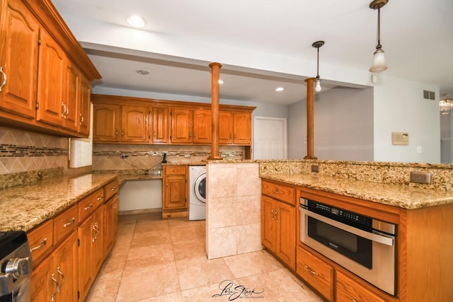 15516 Frontage Rd, Markham, IL 60428 - kitchen with washer / clothes dryer, decorative backsplash, stove, light stone countertops, and brown cabinetry