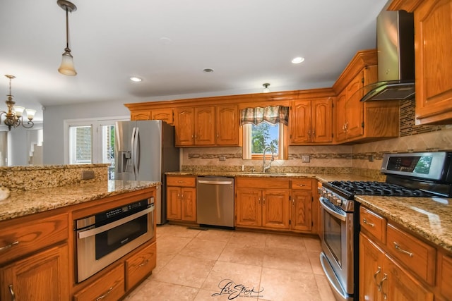 15516 Frontage Rd, Markham, IL 60428 - kitchen with stainless steel appliances, wall chimney exhaust hood, brown cabinetry, decorative backsplash, and recessed lighting