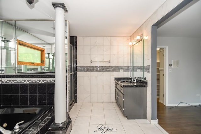 15516 Frontage Rd, Markham, IL 60428 - bathroom featuring tile walls, vanity, a whirlpool tub, tile patterned flooring, and a shower