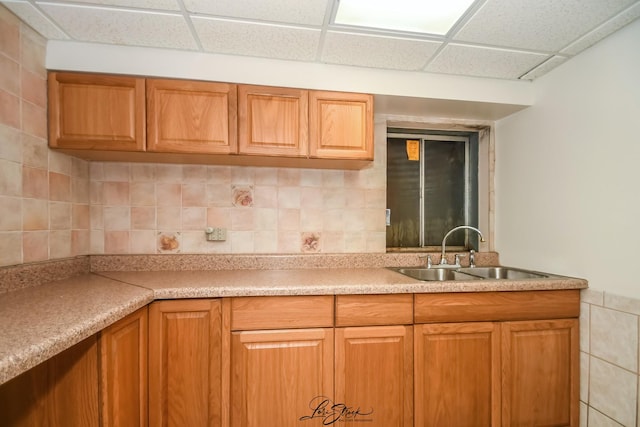 15516 Frontage Rd, Markham, IL 60428 - kitchen featuring a drop ceiling, light countertops, brown cabinets, and decorative backsplash
