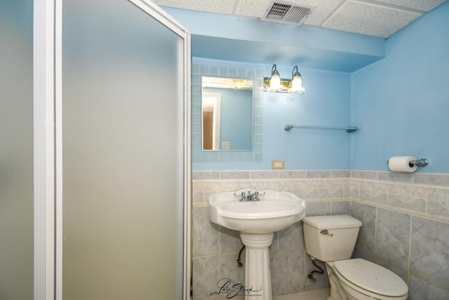 15516 Frontage Rd, Markham, IL 60428 - bathroom featuring wainscoting, tile walls, and a drop ceiling