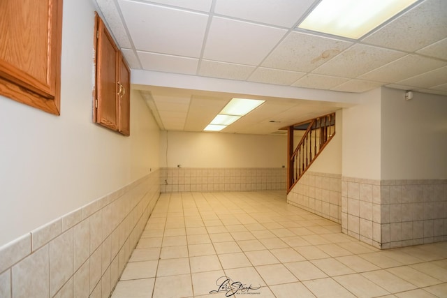 15516 Frontage Rd, Markham, IL 60428 - finished basement with light tile patterned floors, a wainscoted wall, stairway, and a drop ceiling